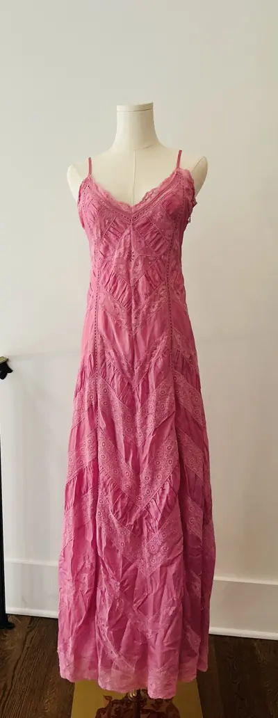 Designer dress on a dress form at Reluxe