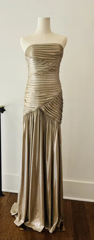 Designer dress on a dress form at Reluxe