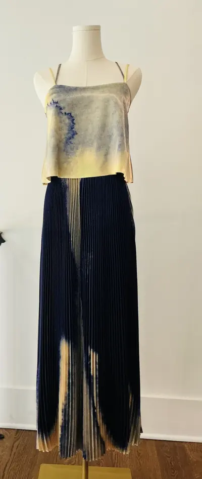 Designer dress on a dress form at Reluxe
